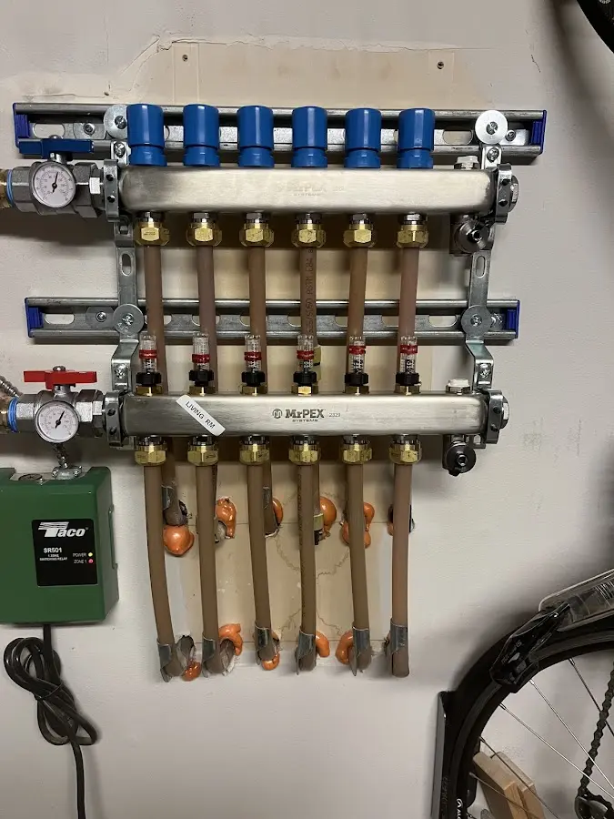 Plumber performing Water Heater Repair at a residential property in Emerald Isle